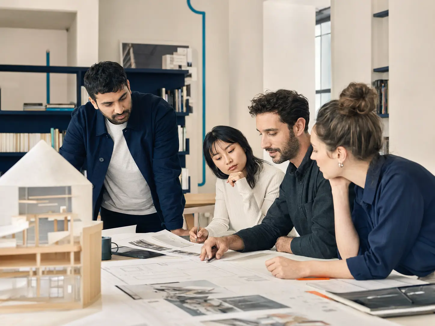 Professionals studying a project plan together